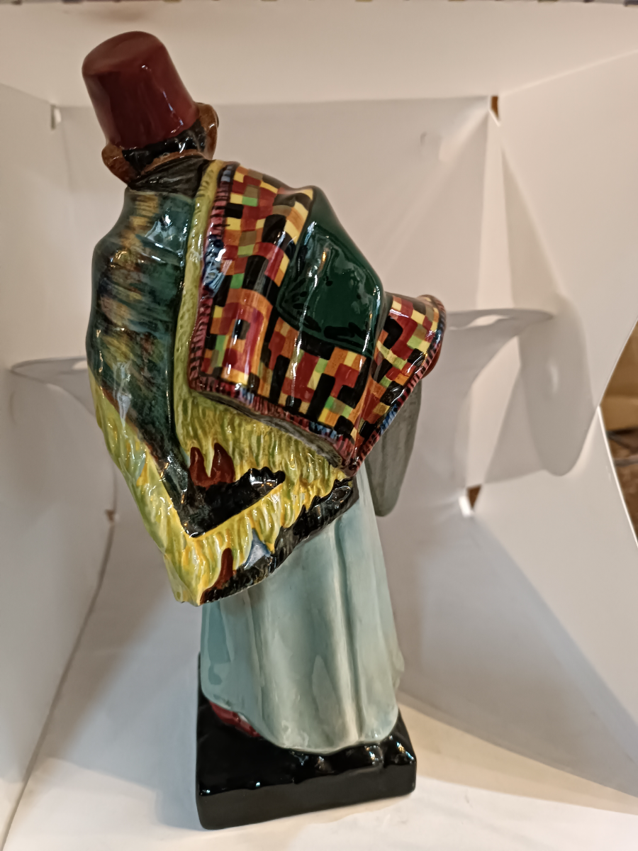 Discover our Royal Doulton Carpet Seller figure designed by Charles Noke. Shop now to bring home this 23cm porcelain masterpiece in good condition.