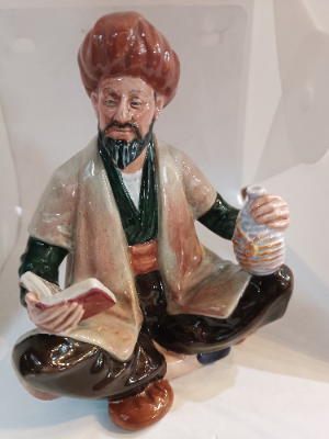 Shop our Royal Doulton Omar Khayyam figure, an exquisite piece of discontinued porcelain crafted by Mary Nicole. Perfect for collectors - secure yours today!