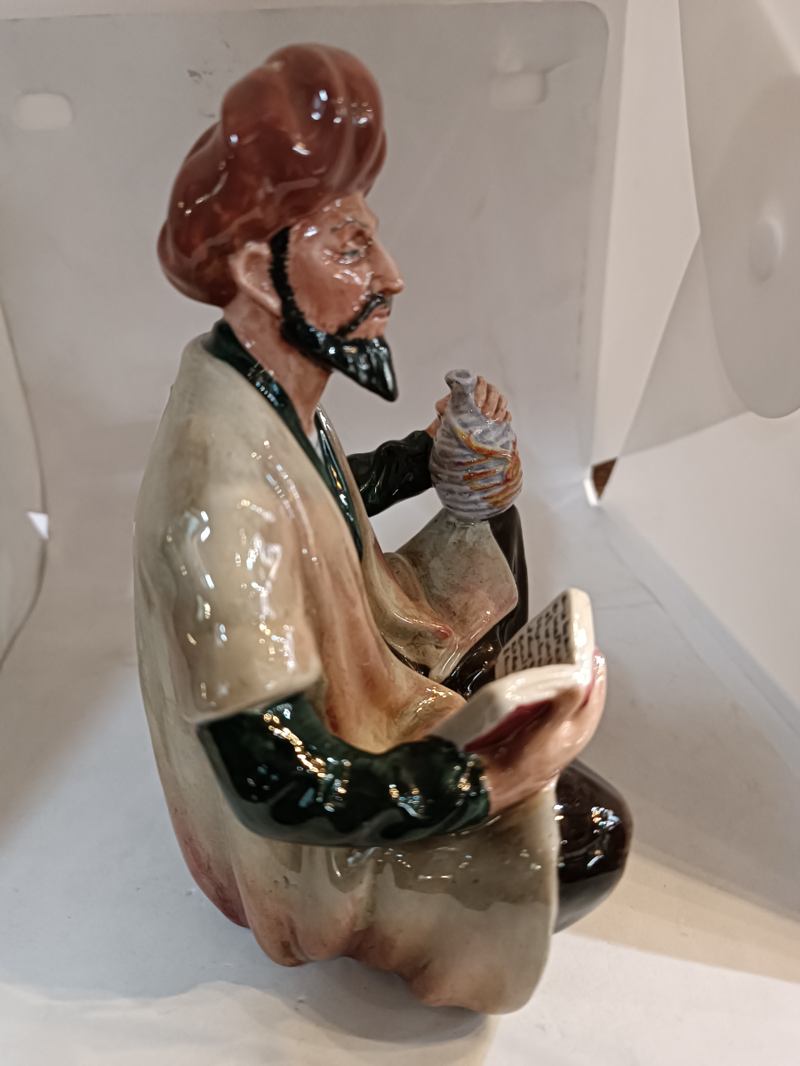 Shop our Royal Doulton Omar Khayyam figure, an exquisite piece of discontinued porcelain crafted by Mary Nicole. Perfect for collectors - secure yours today!