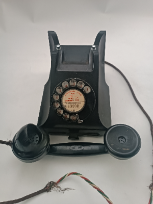 Discover our 20th c. Bakelite telephones in Warrington. Featuring a wire and pullout tray. Order yours today! Relive history with a touch of elegance.
