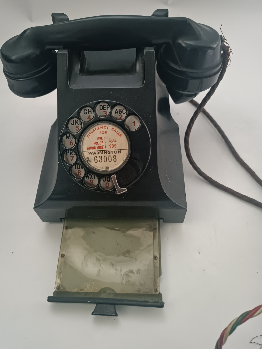 Discover our 20th c. Bakelite telephones in Warrington. Featuring a wire and pullout tray. Order yours today! Relive history with a touch of elegance.