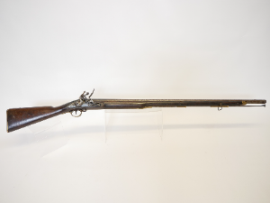 Discover the .750 Brown Bess Flintlock Musket from East India Company. Made in 1798, adorned with EIC crest, Indian arsenal marks and brass fittings. Explore now!