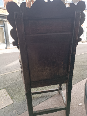 Discover our rare 17th-century oak wainscot armchair from Leeds, Yorkshire. Admire its high-quality scroll-carved top rail, lozenge-carved panel, and check inlaid border. Shop now!