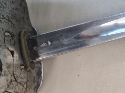 Discover our unique SNCO 1897 Edward VII Sword without scabbard, bend tested and WD marked, dated May 1903. Experience history in the palm of your hand. Shop now!