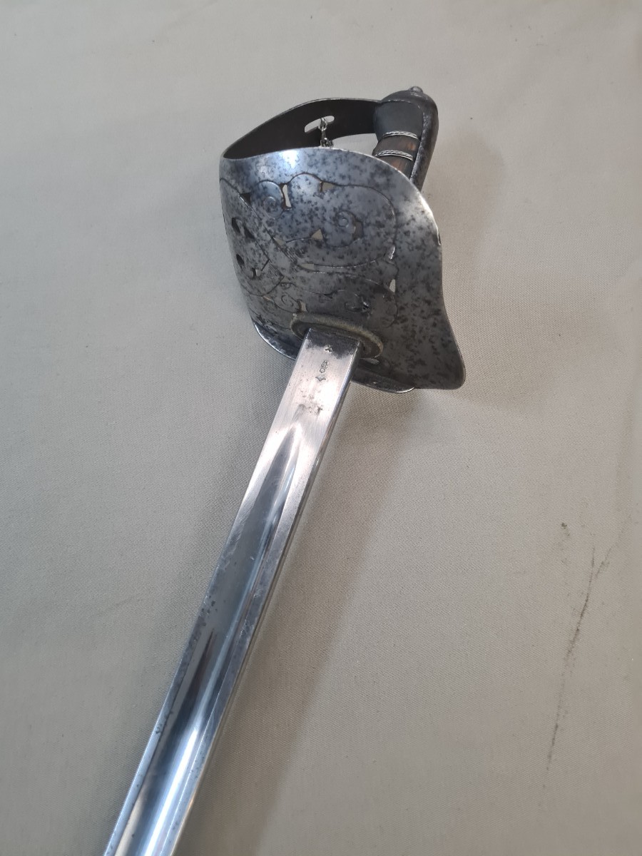 Discover our unique SNCO 1897 Edward VII Sword without scabbard, bend tested and WD marked, dated May 1903. Experience history in the palm of your hand. Shop now!