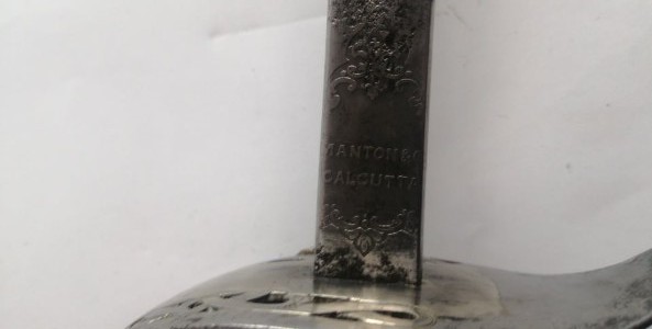 Discover our 1897 Victorian Indian officers sword, originally owned by a Regular officer and later used by the Calcutta Scottish Regiment. Features unique thistles insignia, queen's crown, and a historical badge. Shop now and own a piece of history!