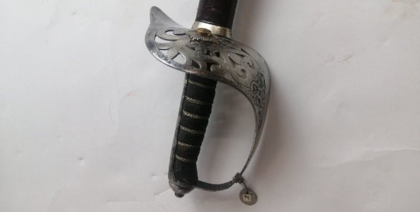 Discover our 1897 Victorian Indian officers sword, originally owned by a Regular officer and later used by the Calcutta Scottish Regiment. Features unique thistles insignia, queen's crown, and a historical badge. Shop now and own a piece of history!