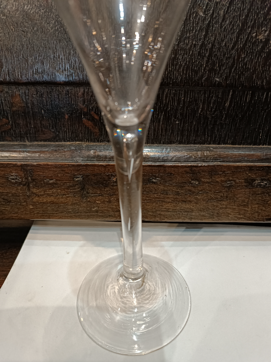 Explore our collection of mid 18th century Georgian toasting Glasses. Featuring lead glass with snapped pontil and a unique air tear. Order now for the perfect toast!