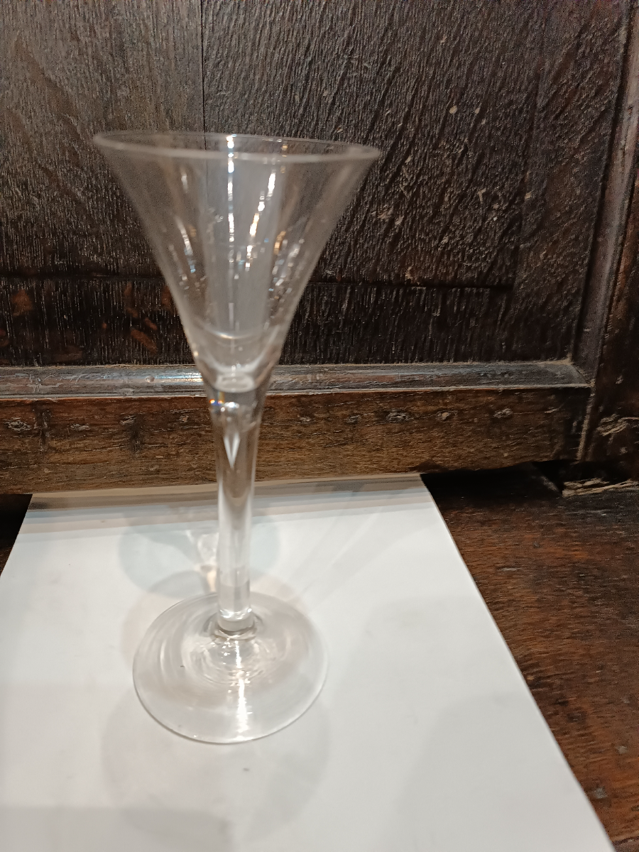 Explore our collection of mid 18th century Georgian toasting Glasses. Featuring lead glass with snapped pontil and a unique air tear. Order now for the perfect toast!