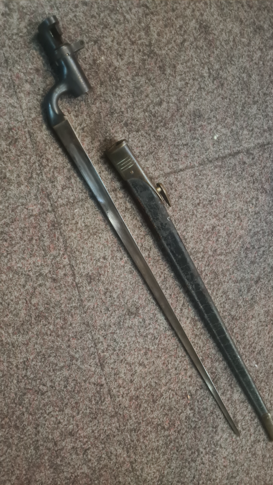 1900 dated Martini Enfield bayonet. WD marked, inspected by Enfield. With scabbard.