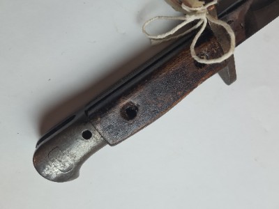Explore authentic British 1907 bayonet, dated July 1915 with Enfield stamps. Buy now to own a piece of history, despite missing grip screws.