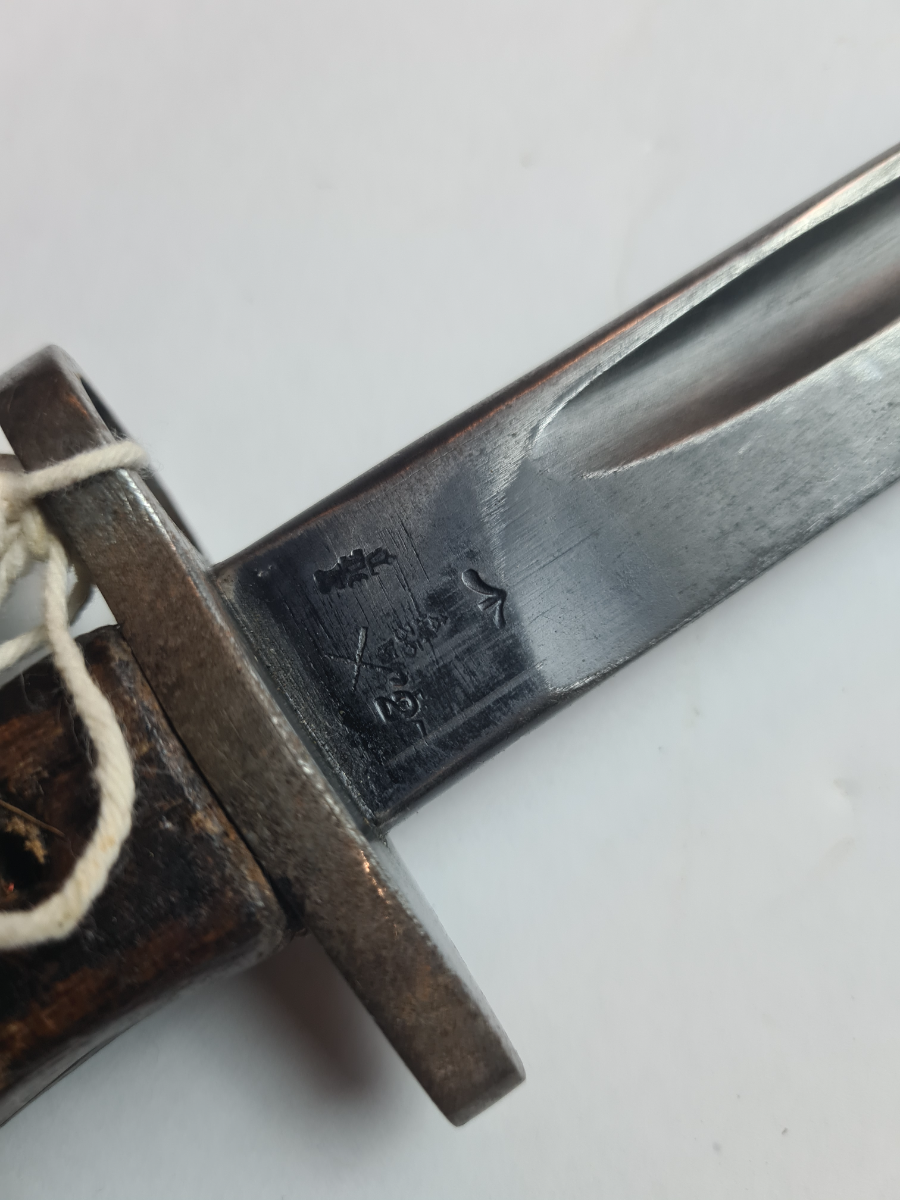 Explore authentic British 1907 bayonet, dated July 1915 with Enfield stamps. Buy now to own a piece of history, despite missing grip screws.