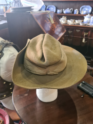 Explore our collection of 1942-dated Royal Artillery enlisted slouch caps by Atherton. Featuring 4 vents, chinstrap, and liner in good condition! Shop now.