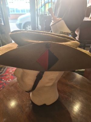 Explore our collection of 1942-dated Royal Artillery enlisted slouch caps by Atherton. Featuring 4 vents, chinstrap, and liner in good condition! Shop now.