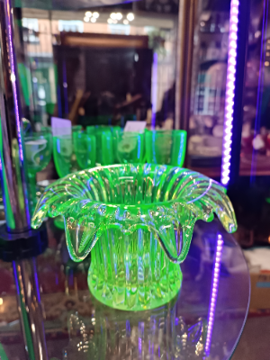 Discover our collection of 19th century uranium glass bowls. This stunning piece, with its unique light yellow/green hue and dash of history, is waiting for you. Shop now!