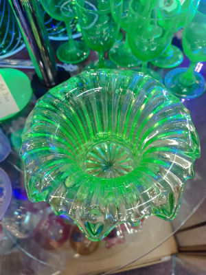 Discover our collection of 19th century uranium glass bowls. This stunning piece, with its unique light yellow/green hue and dash of history, is waiting for you. Shop now!