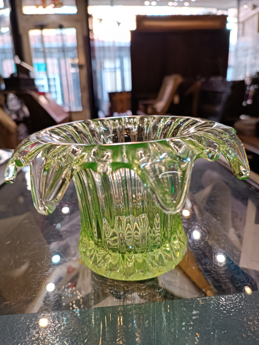 Discover our collection of 19th century uranium glass bowls. This stunning piece, with its unique light yellow/green hue and dash of history, is waiting for you. Shop now!