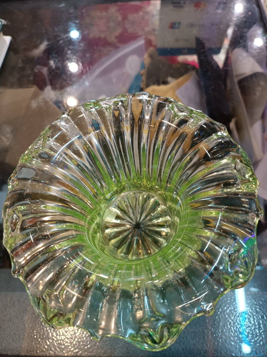 Discover our collection of 19th century uranium glass bowls. This stunning piece, with its unique light yellow/green hue and dash of history, is waiting for you. Shop now!