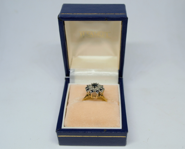 Discover vintage elegance with our 9ct gold ring, featuring a sapphire & diamond cluster. Hallmarked London 1978. Shop now for unique, timeless luxury!