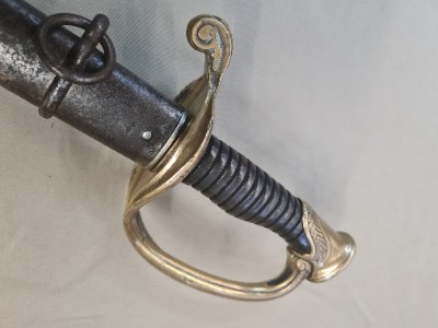 Explore our collection of 20th Century French Model 1845/55 Infantry Officer's Swords. Made in 1915, features a 77cm steel blade and intricate brass hilt. Shop now!