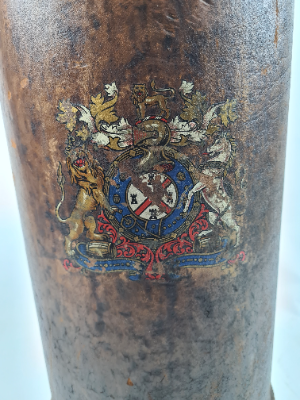 Discover our unique 20th century leather cordite carrier, adorned with an unknown coat of arms. Brilliant in condition despite minimal fraying. Shop now to add to your collection!