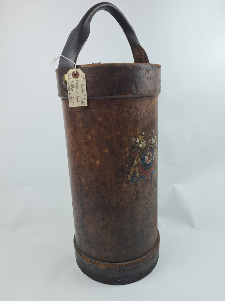 Discover our unique 20th century leather cordite carrier, adorned with an unknown coat of arms. Brilliant in condition despite minimal fraying. Shop now to add to your collection!