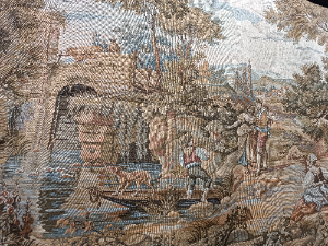 A 20th century Tapestry depicting a couple in ideallic landscape with lining.  It has loops on top for hanging on the wall.  Size 120 x 65 cm.