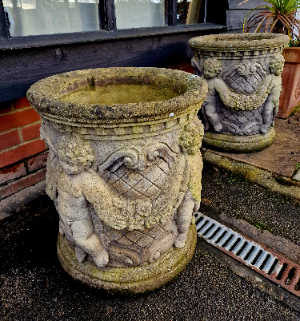 A Pair Of Cherub Garden Urns