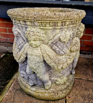 A Pair Of Cherub Garden Urns