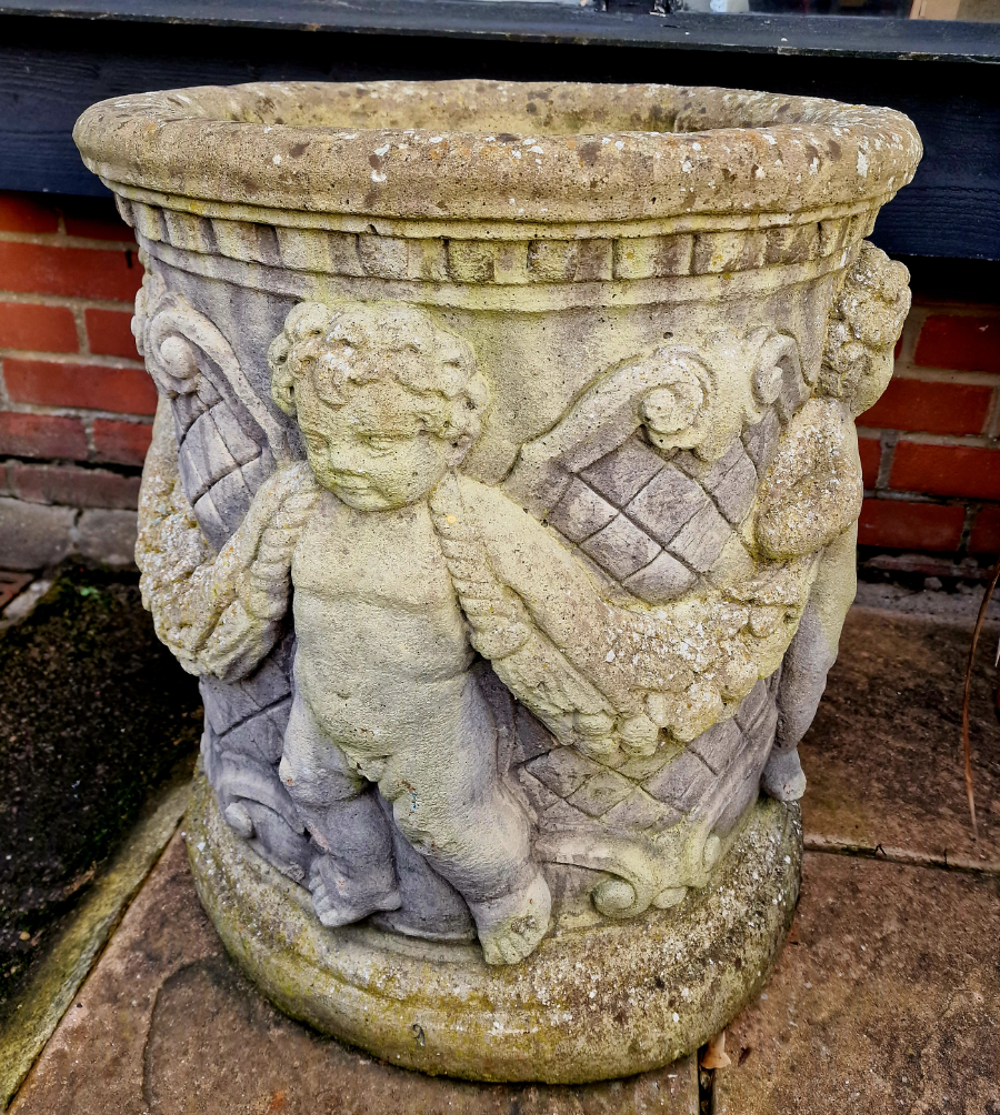 A Pair Of Cherub Garden Urns