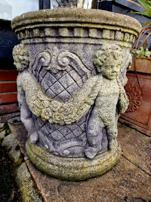 A Pair Of Cherub Garden Urns