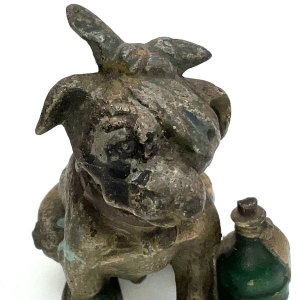 Lovely little dog from the late 19th century stands 9 cm high length 5 cm depth 7 cm stamped austria on bottom overall condition is needing repaint but otherwise excellent has nodding head feature,