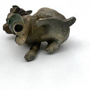 Lovely little dog from the late 19th century stands 9 cm high length 5 cm depth 7 cm stamped austria on bottom overall condition is needing repaint but otherwise excellent has nodding head feature,