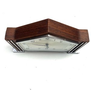 Nice time piece, teak wood cased with chromed fittings, eight day mechanical movement possibly swiss, condition overall is excellent and keeps excellent time length 23 cm height 14 cm depth 5 cm,
