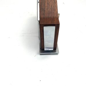 Nice time piece, teak wood cased with chromed fittings, eight day mechanical movement possibly swiss, condition overall is excellent and keeps excellent time length 23 cm height 14 cm depth 5 cm,