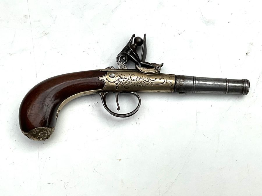 An 18th Century Flintlock Queen Anne-type Greatcoat Pistol By I Parr, London.
