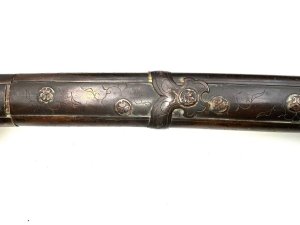 Unsigned longsword big wide and powerful blade has torizori shallow curve lots of niko in old polish couple of small flaws on back plane of blade. Mounts kosherae are meiji period quality fittings covered in tokugawa rulers of japan with family mon badges, a very impressive tachi with early koto blade in superb japanese polish, length in total 116 cm width 9 cm height 9 cm,