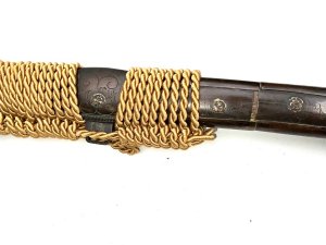 Unsigned longsword big wide and powerful blade has torizori shallow curve lots of niko in old polish couple of small flaws on back plane of blade. Mounts kosherae are meiji period quality fittings covered in tokugawa rulers of japan with family mon badges, a very impressive tachi with early koto blade in superb japanese polish, length in total 116 cm width 9 cm height 9 cm,