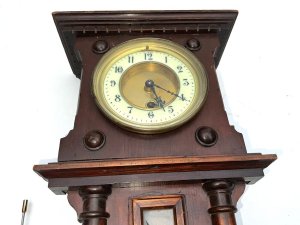 Lovely proportion wall clock in good working order and condition comes with original pendulum and key, length being 53 width of 22 cm depth being 12 cm