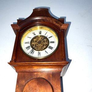Miniature clock, mahogany with shell inlays having an 8 day mechanical movement that’s in perfect working order, the case is in excellent condition, consider one of the very best, standing 55 cm high width at widest 15 cm depth being 11 cm comes with key, offering free delivery worldwide reference frs tel: we accept online payments for all our items listed: bank transfer cash on collection or if wishing over the phone using your debit or credit cards, also doing layby payments plan, or email giving your address details & contact number and we shall send you your items invoice to make