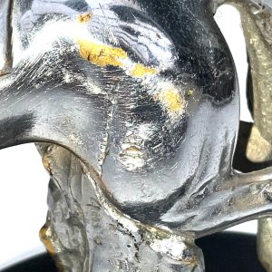A super bronze jumping horse & rider car mascot. Made from chromed bronze, in the form of a horse & rider jumping a fence, this mascot has been mounted on a black marble base early 20th century, makers name on horses flank, conditions used showing some blemishes, placed on black base for display looks inspiring, standing 18 cm high to include base, length of 14 cm bases diameter 16 cm.