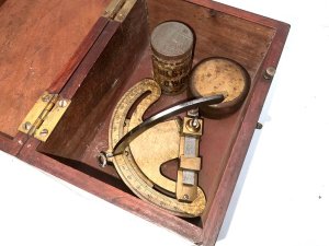 Tool in its original mahogany box, both box and instrument are in good condition though box missing the bottom nob sizes of box are height 15 cm length 17 cm depth being 12 cm,
