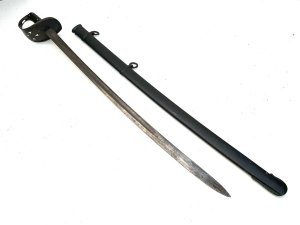 British (troopers) cavalry sabre ! Looks like a p1885. German made (not un common) scabbard dated and marked xi h for 11th hussars (the attribution may be spurious as the date is wrong). The yc on the blade denotes later issue to a yeoman cavalry regiment. Blades showing battle chips but still good has stains but will polish up. Has original scabbard which is dated for 1875 length of 106 cm height 14 cm depth 9 cm.