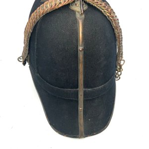 Royal military academy sandhurst officer badge and 1878 pattern blue cloth helmet, complete with all gilt metal fittings, crowned star pattern plates with gilt mounts. Good condition, being old has the odd blemish,