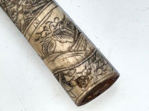 Superbly carved with intricate japanese scenes comes this tanto knifes handle, not perfect but restored will be unbelievable, having length of 129 mm width across being 35 mm de-th of 26 mm,