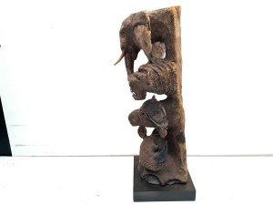 Super mid victorian carving of the mammals that live on the plains of the serengeti, carved from solid wood brought back to uk by south african, stands 58 cm width 22 cm depth 20 cm,