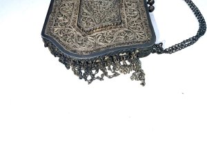 Solid silver filigree designs that are quite stunning, very heavy comes in very good condition sizes being 14 cm in length stands 10 cm high depth being 25 mm and weights 283 grams,