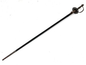 Early 18th century, this gentleman's swords in quite good condition, the three edged blade has the odd blemish that will polish out, the scabbards complete though showing some restoration, the overall length from tip to tips 99 cm across the guard is 7 cm height at guard being 9 cm blades from steels tip to top of handles 97cm and is beautifully engraved on all three edges,