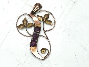Vintage item stamped for 9ct rose gold, beautiful rubie stones at least half a carat combined, stands 4 cm high width being 2.6 cm