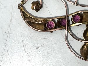 Vintage item stamped for 9ct rose gold, beautiful rubie stones at least half a carat combined, stands 4 cm high width being 2.6 cm